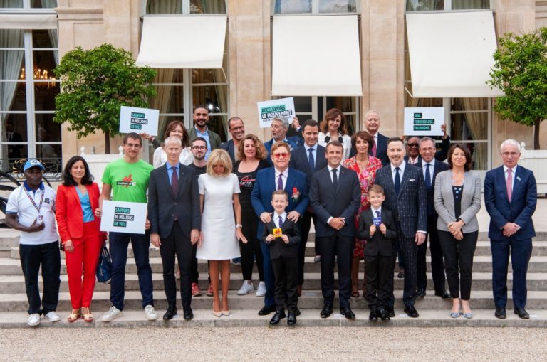 Group picture after Elton John received the Légion d'Honneur from president Emmanuel Macron for his commitment to ending AIDS.