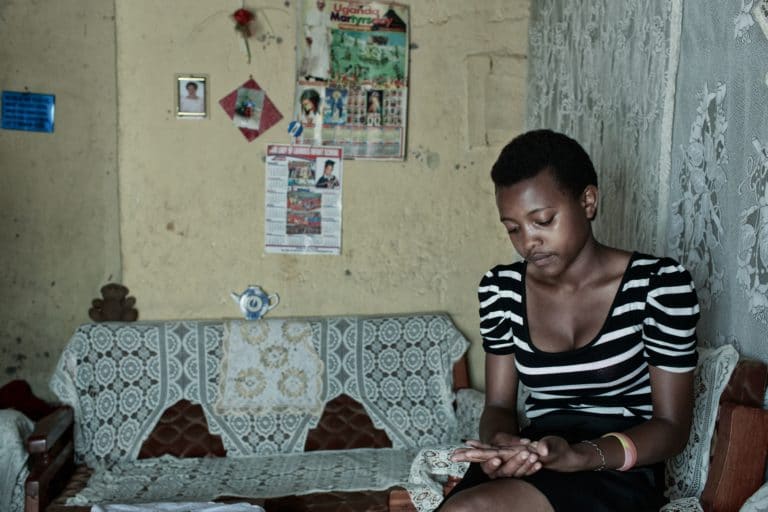 Mercy is 16 years old and has been living with HIV since birth. She is sitting in her living room and sharing her story, and how the programme funded by the Elton John AIDS Foundation has supported her.