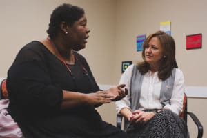 Faith speaks to the Foundation's CEO during a visit to Atlanta.