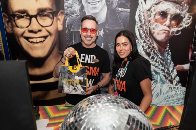 David Furnish behind the till at the Elton John Eyewear pop-up to celebrate Pride
