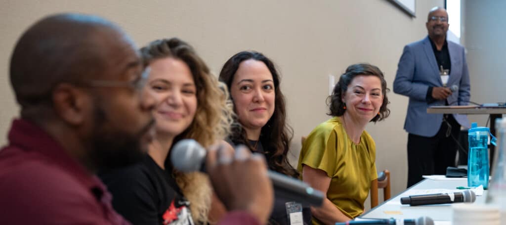 Mixed group of panelists in a row.